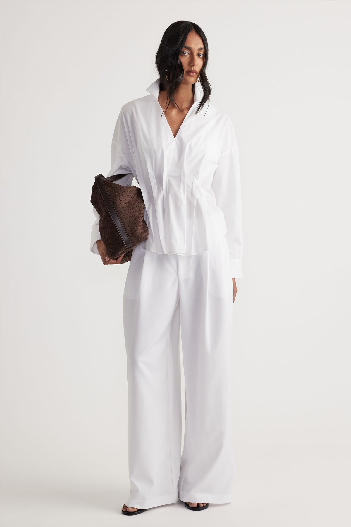 Clara Pleated Pant in white with wide-leg cut and high waist, styled with crisp white shirt by DECJUBA Australian fashion brand