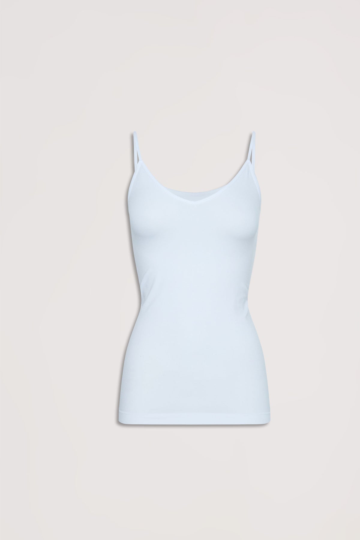 Light blue seamless tank with thin straps, offering a smooth and comfortable fit for effortless layering.