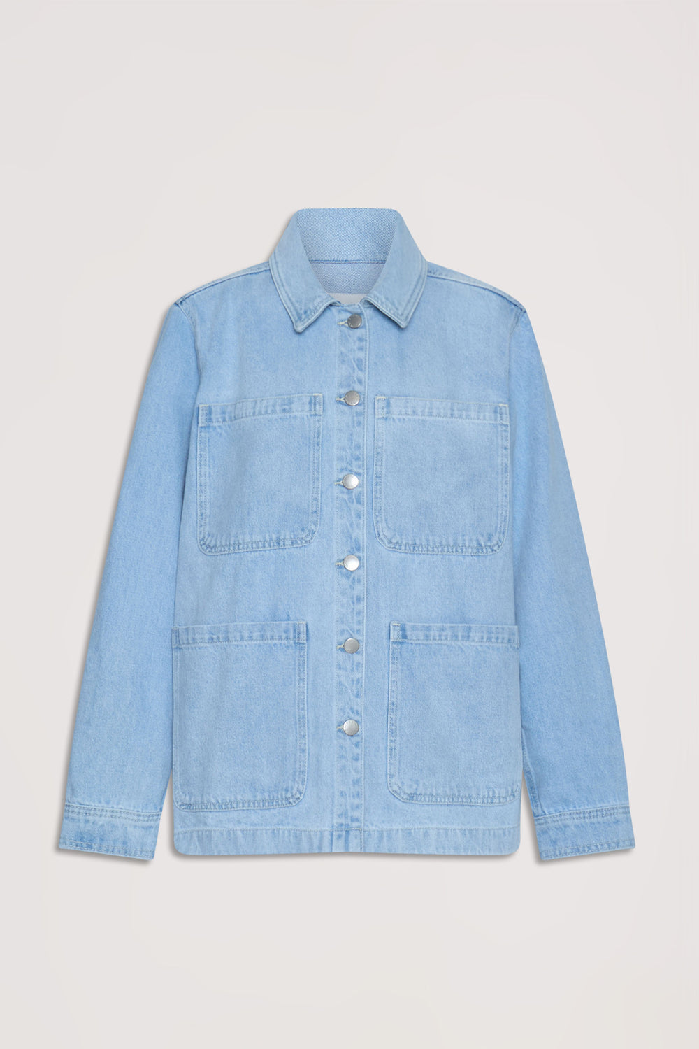 Light wash denim shacket with oversized front pockets and silver snap buttons for a relaxed, casual layer.