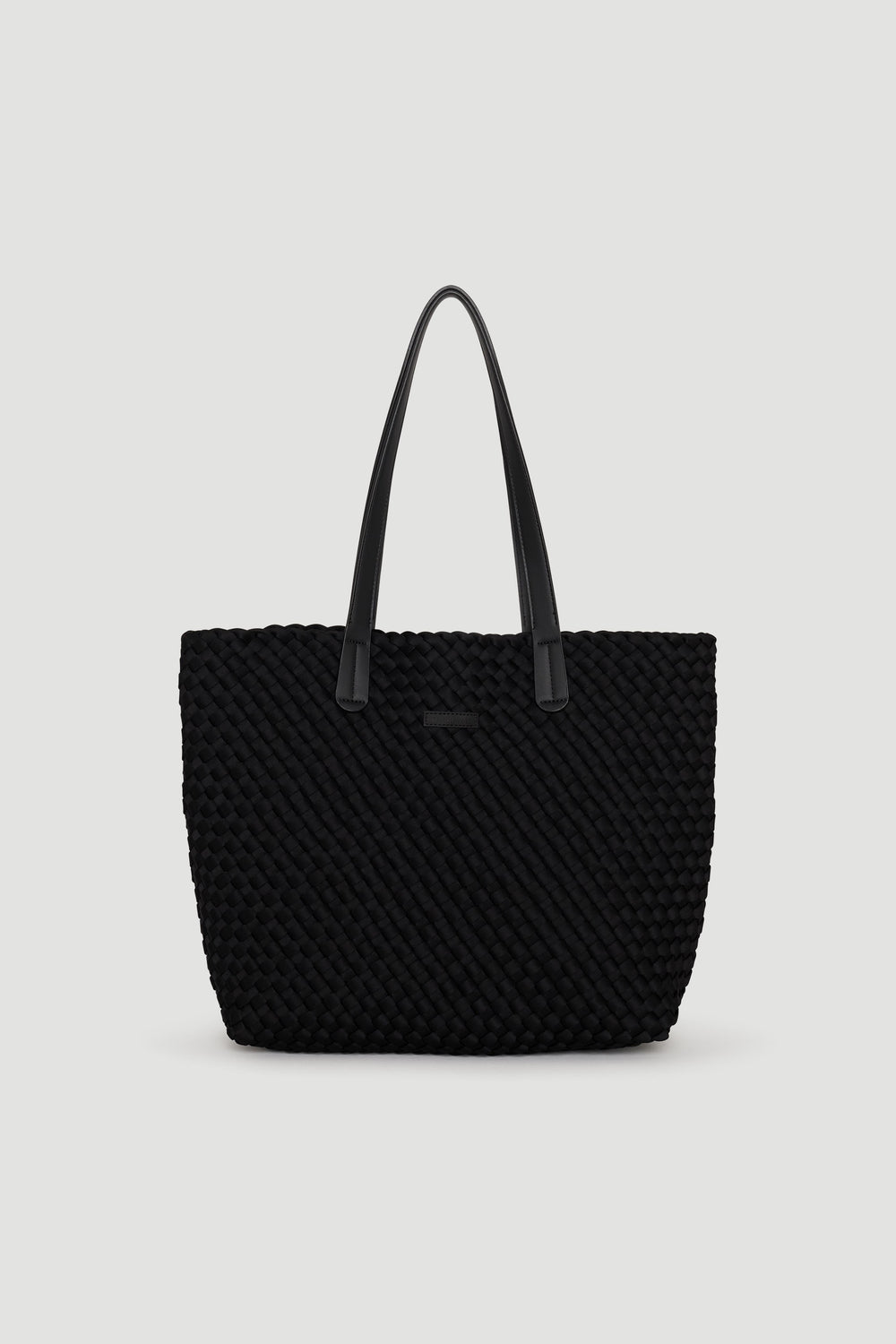 Black woven tote bag with long handles, featuring a textured design for chic, everyday use.