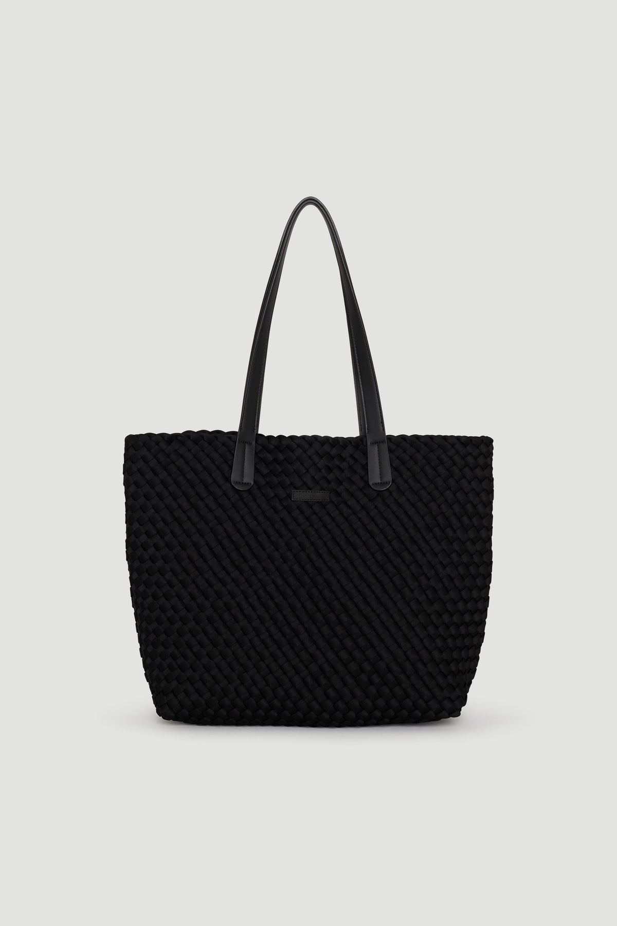 Black woven tote bag with long handles, featuring a textured design for chic, everyday use.