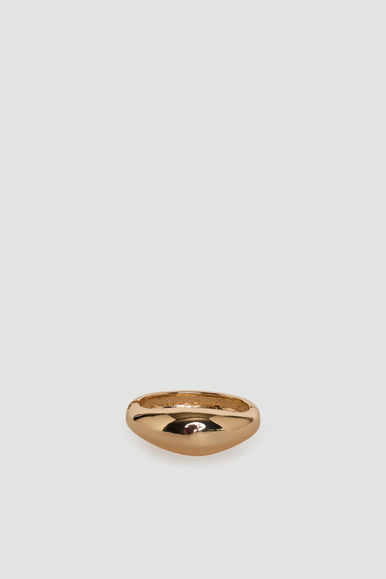 Smooth polished gold-tone bangle with a rounded, minimalist design for everyday versatile wear.