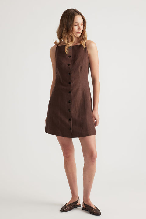 Woman wearing Benne Button Front Vest Dress in brown with square neckline and button through closure, gallery position 1 portrait