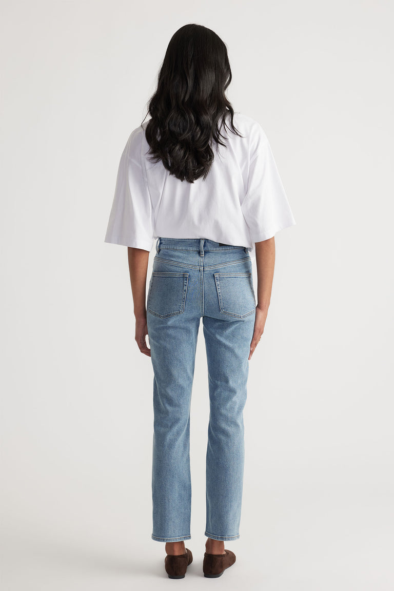 Back view of Becky Hemmed Straight Leg Jean in light wash denim styled casually by Decjuba Australian fashion brand