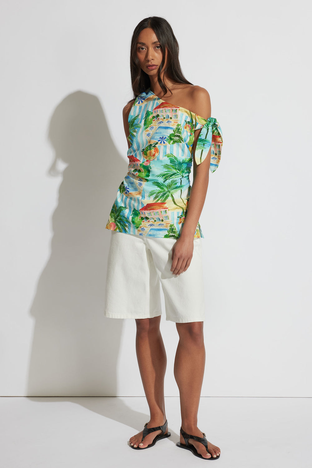 Serafina Tip Shoulder Top in portrait gallery shot, featuring vibrant tropical print and tie detailing on shoulder