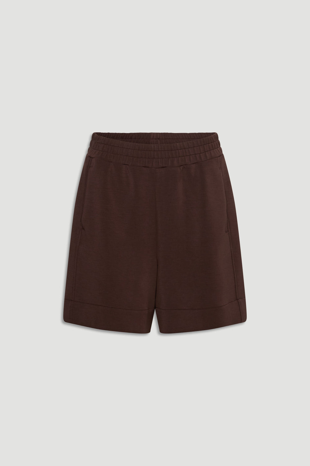 Dark walnut neoprene shorts with elastic waistband and side pockets for a comfortable, modern casual style