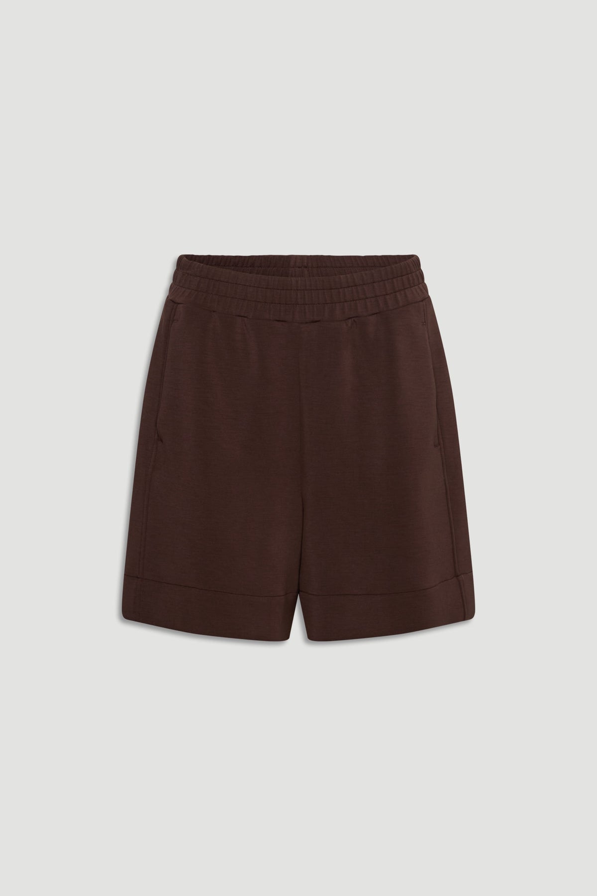 Dark walnut neoprene shorts with elastic waistband and side pockets for a comfortable, modern casual style