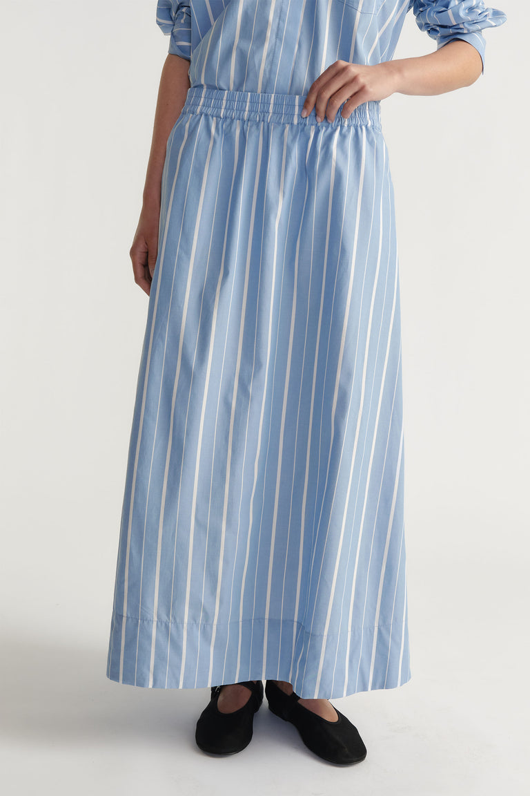 D-Luxe Poplin Stripe Skirt in portrait, showing elasticated waistband and vertical stripes on full A-line maxi length.