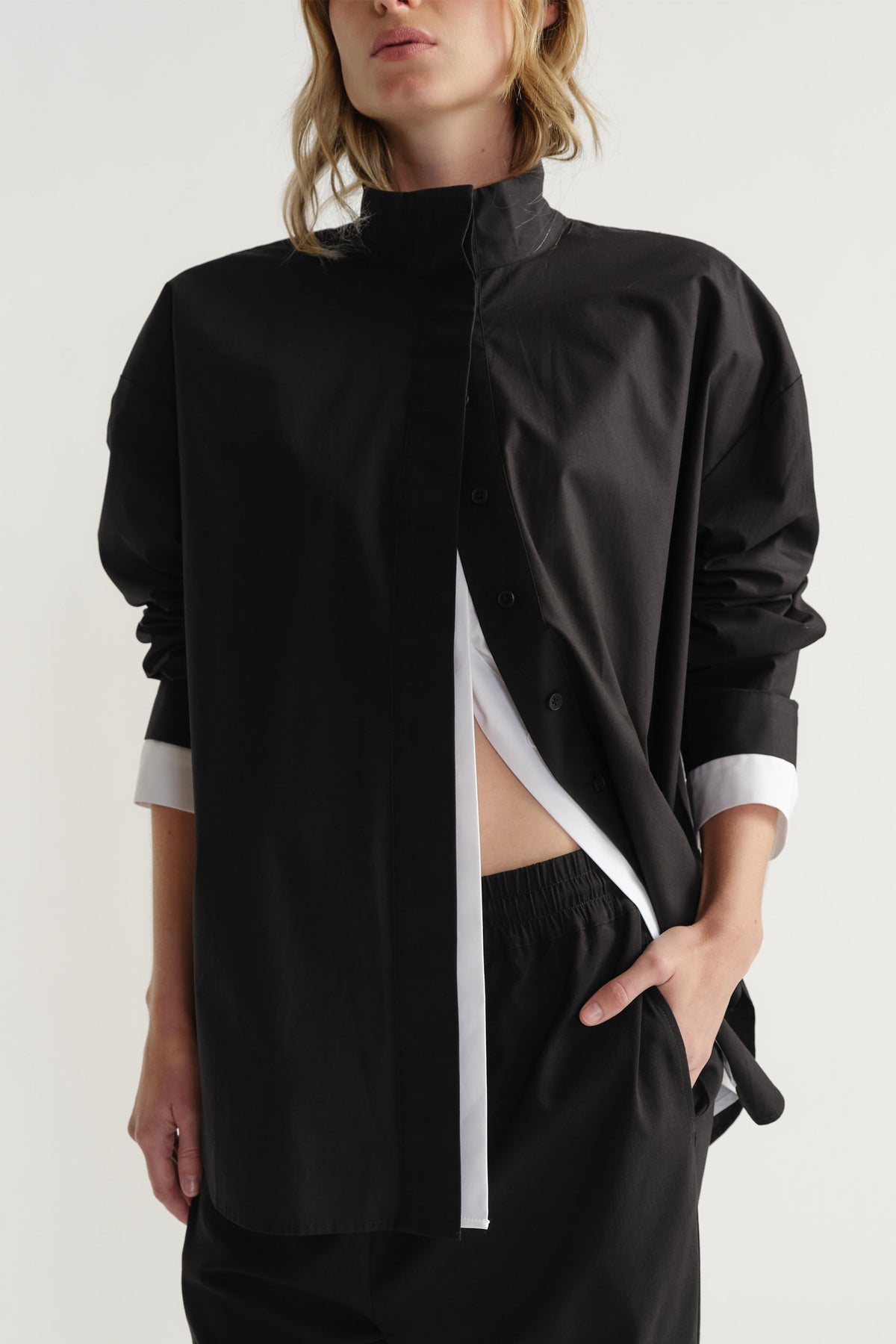 Woman wearing D-Luxe Button Up Shirt in 100% cotton with high collar and contrasting white detail by DECJUBA Australian fashion brand