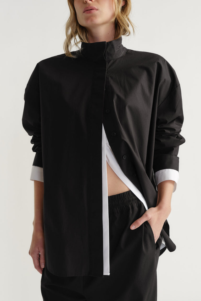 Woman wearing D-Luxe Button Up Shirt in 100% cotton with high collar and contrasting white detail by DECJUBA Australian fashion brand