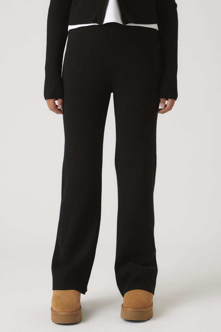 Girls Matilda Knit Pant in black ribbed knitwear with a relaxed straight leg, styled with tan boots by DECJUBA Australian brand