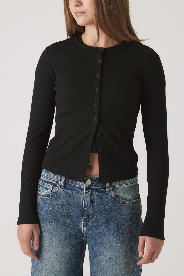Girls Riley Rib Long Sleeve in black rib cotton, button front, fitted style worn with denim jeans in portrait gallery shot 2