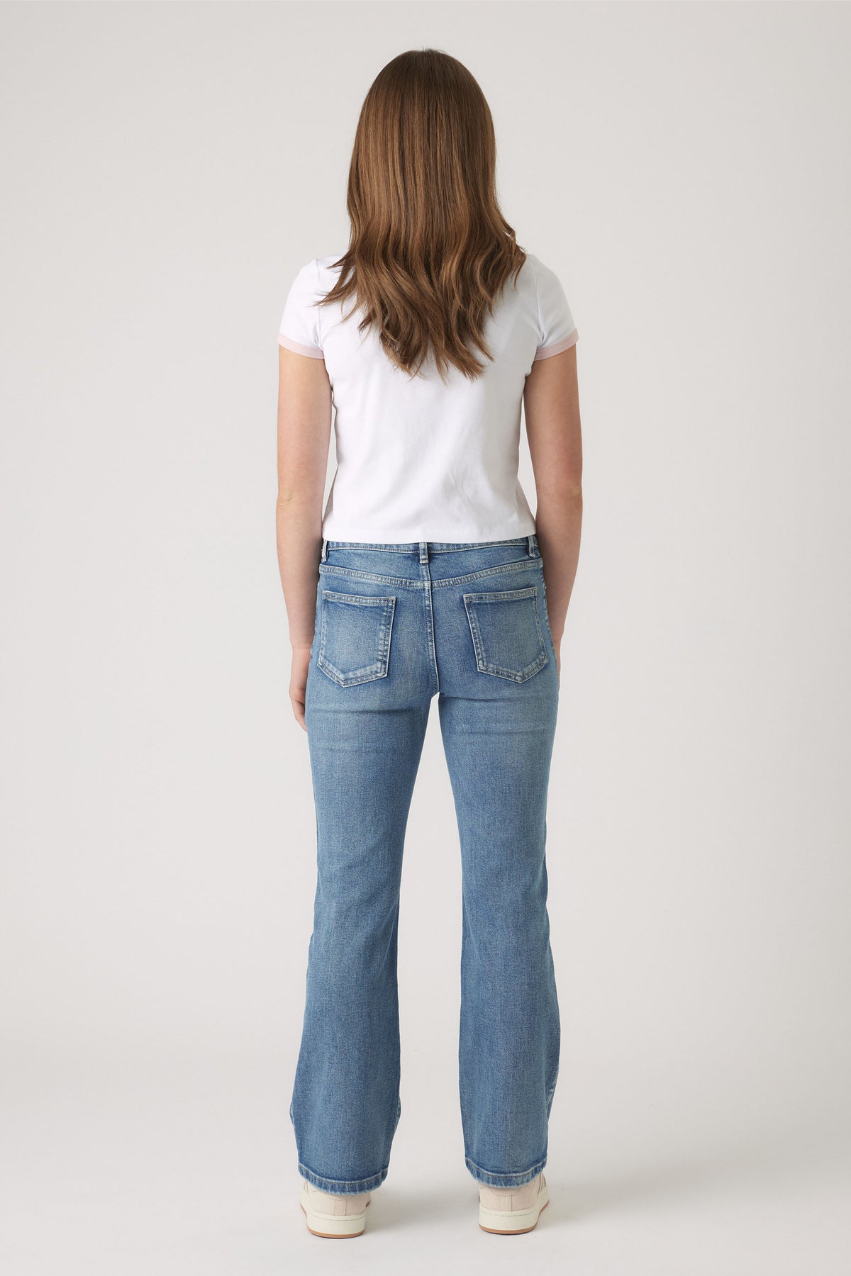 Girls Cropped Ringer Tee in white paired with classic blue denim jeans, styled for a casual everyday look by DECJUBA Australian brand
