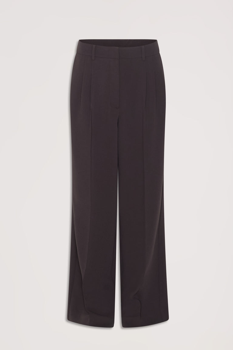 Dark tailored wide-leg pants with belt loops and pressed creases for a sleek, versatile work-to-weekend look