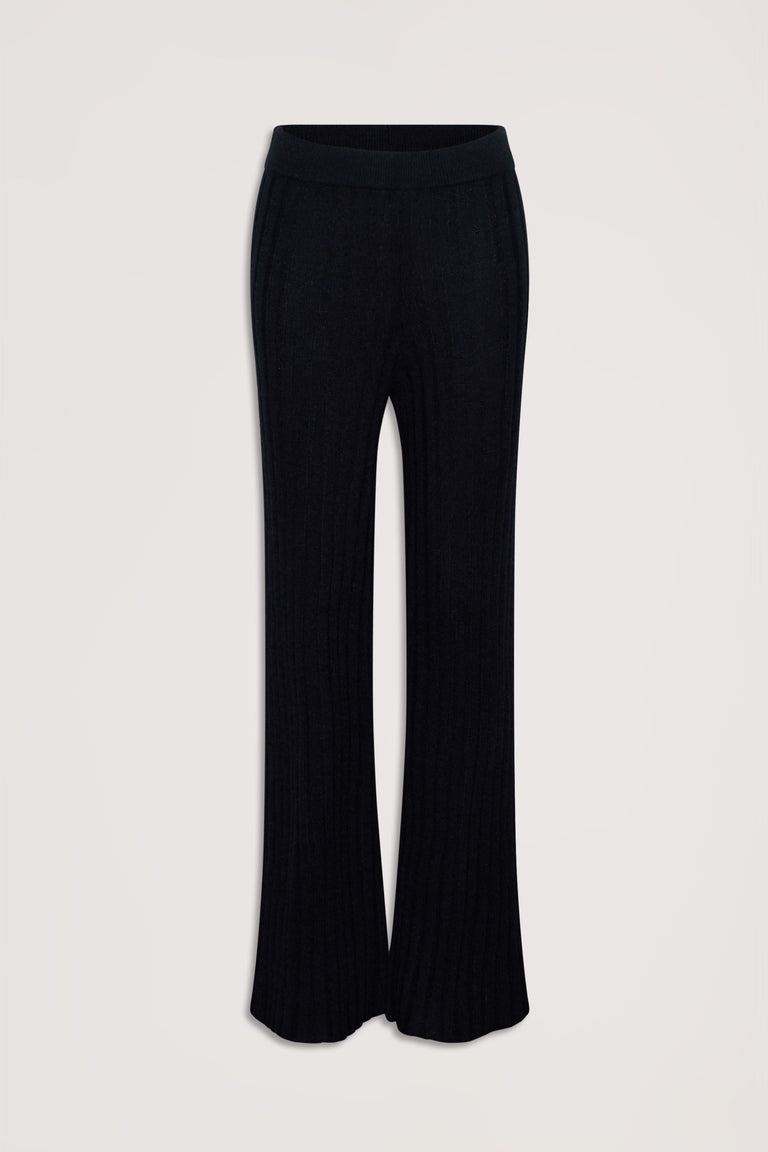Black rib knit pants with a high waist and a relaxed flare silhouette, styled for comfortable everyday wear.