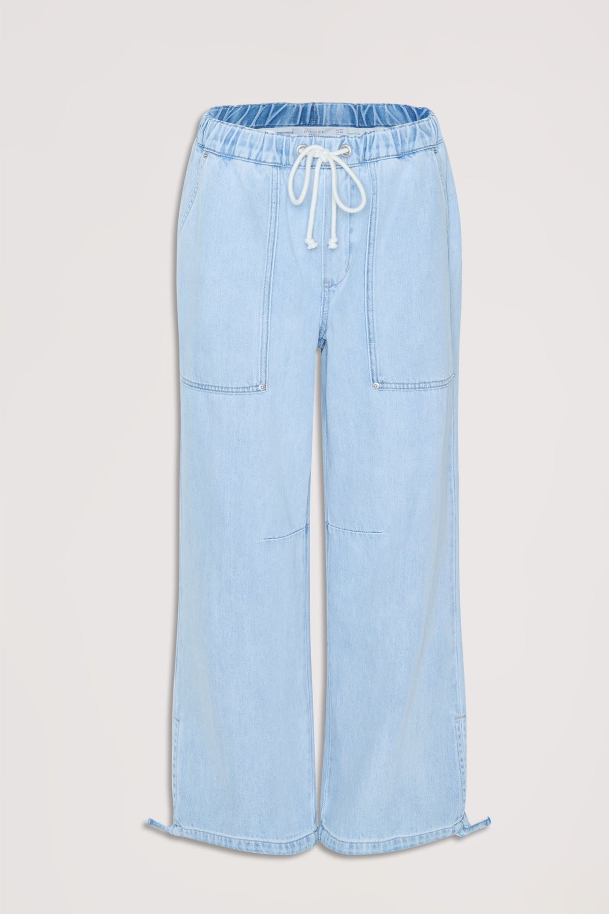 Light wash denim joggers featuring an elastic drawstring waist and relaxed wide-leg fit for casual comfort.
