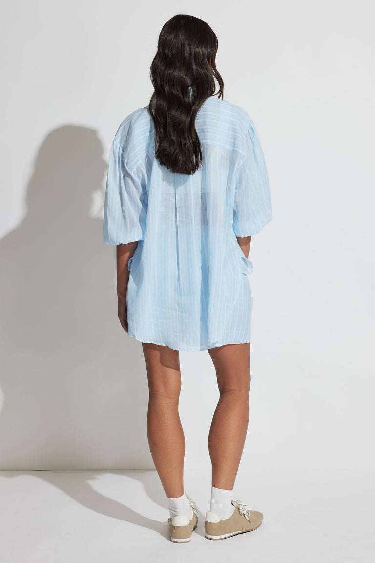 Model wearing Brooke Ramie Short in portrait gallery shot three, showing back view with relaxed fit and light fabric texture