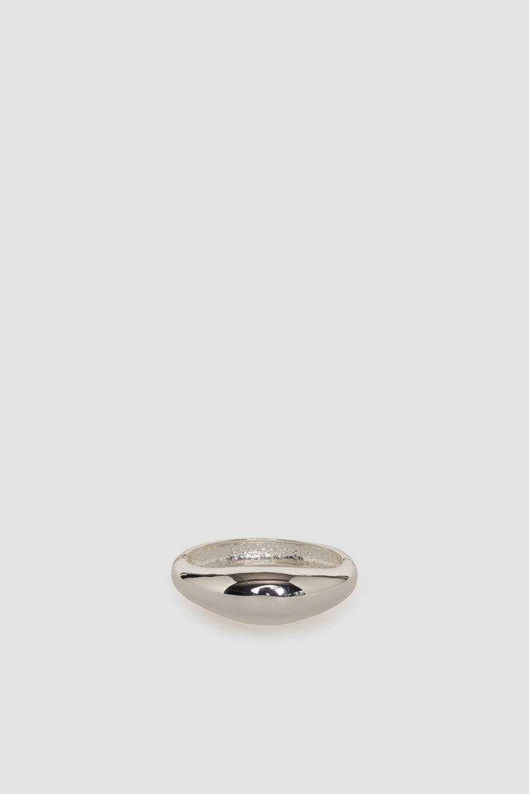 Smooth silver-tone bangle with a polished finish, showcasing a simple and elegant rounded design.