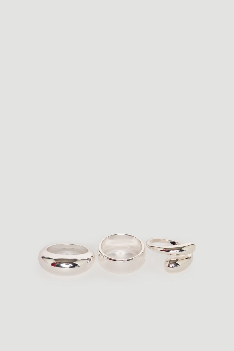 Set of three polished silver rings including a classic band, a wider band, and an open swirl design ring.