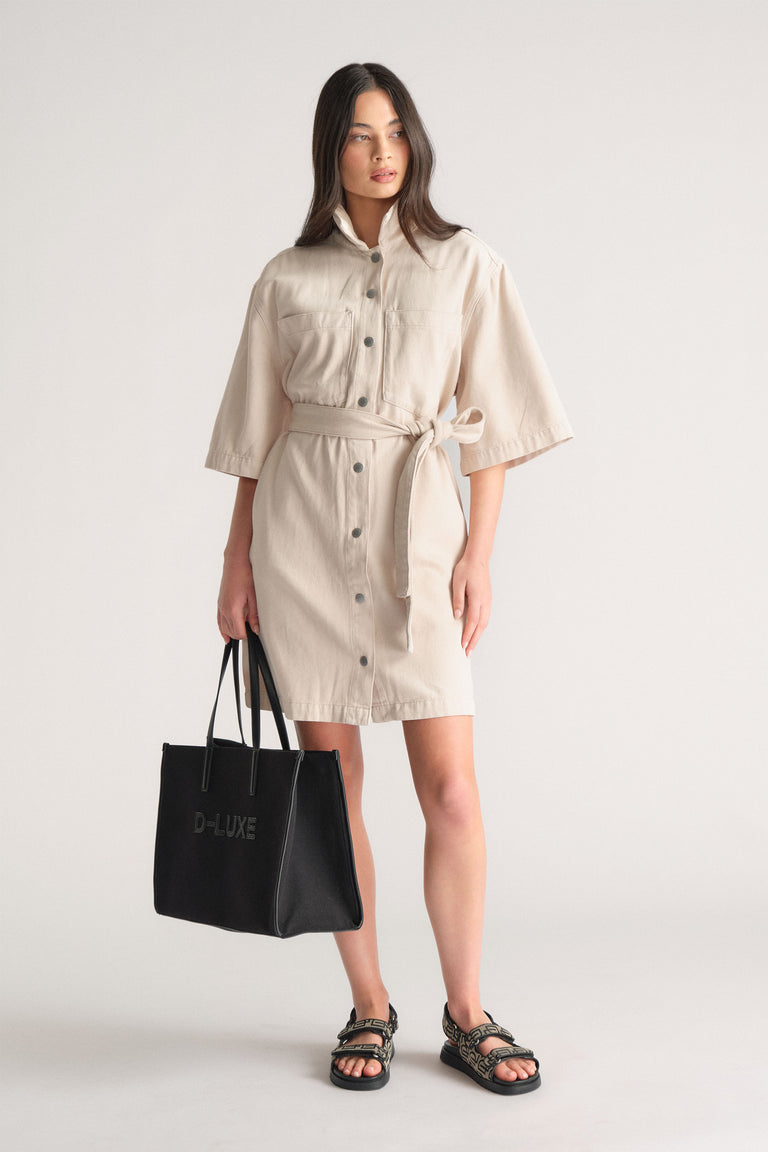 Model wearing a cream D-Luxe Denim Short Dress with waist tie and elbow-length sleeves, gallery position one, portrait orientation.