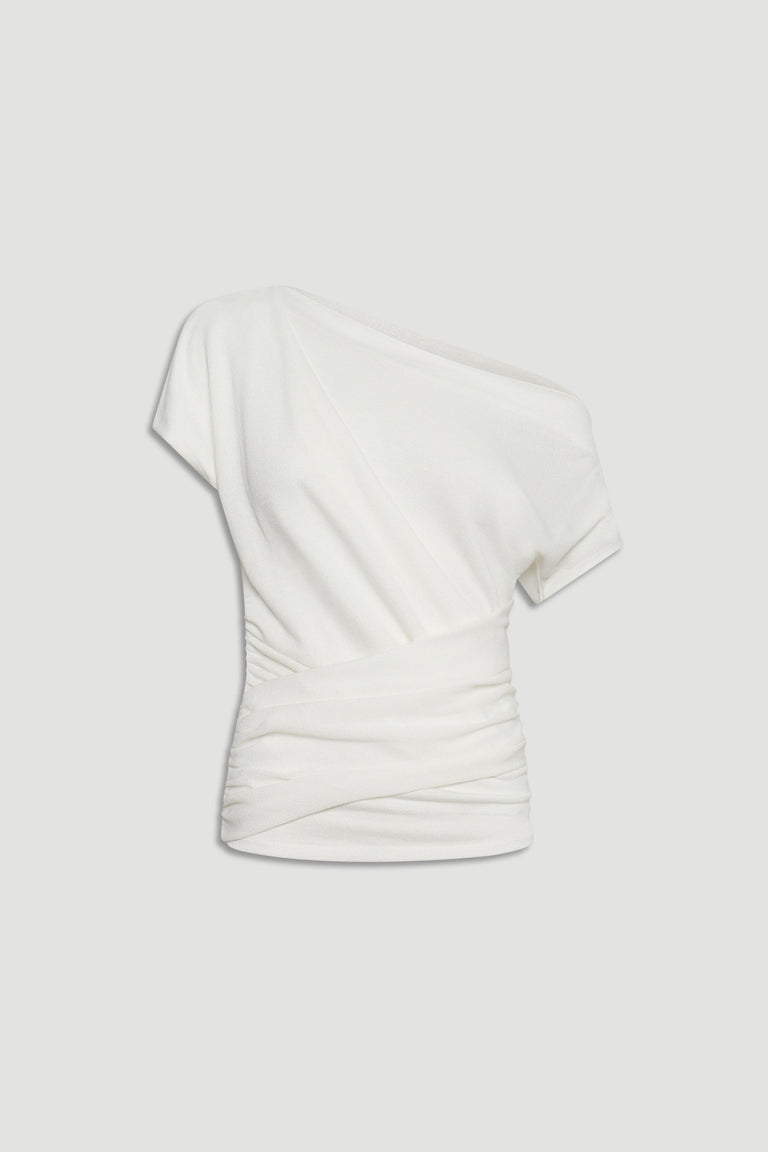Ivory one-shoulder top with gathered detailing and a fitted waist for a chic, elegant silhouette.