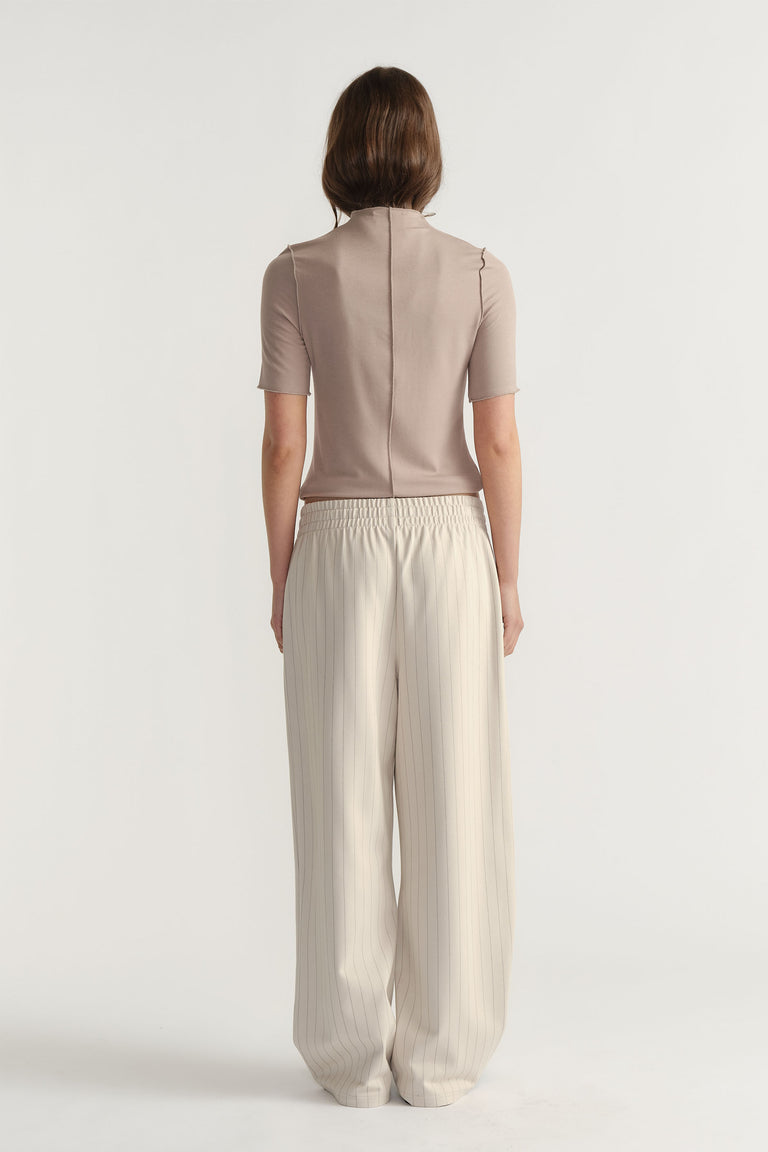 Back view of D-Luxe Pinstripe Pant in light beige with elastic waist and relaxed wide-leg fit by Decjuba Australian brand