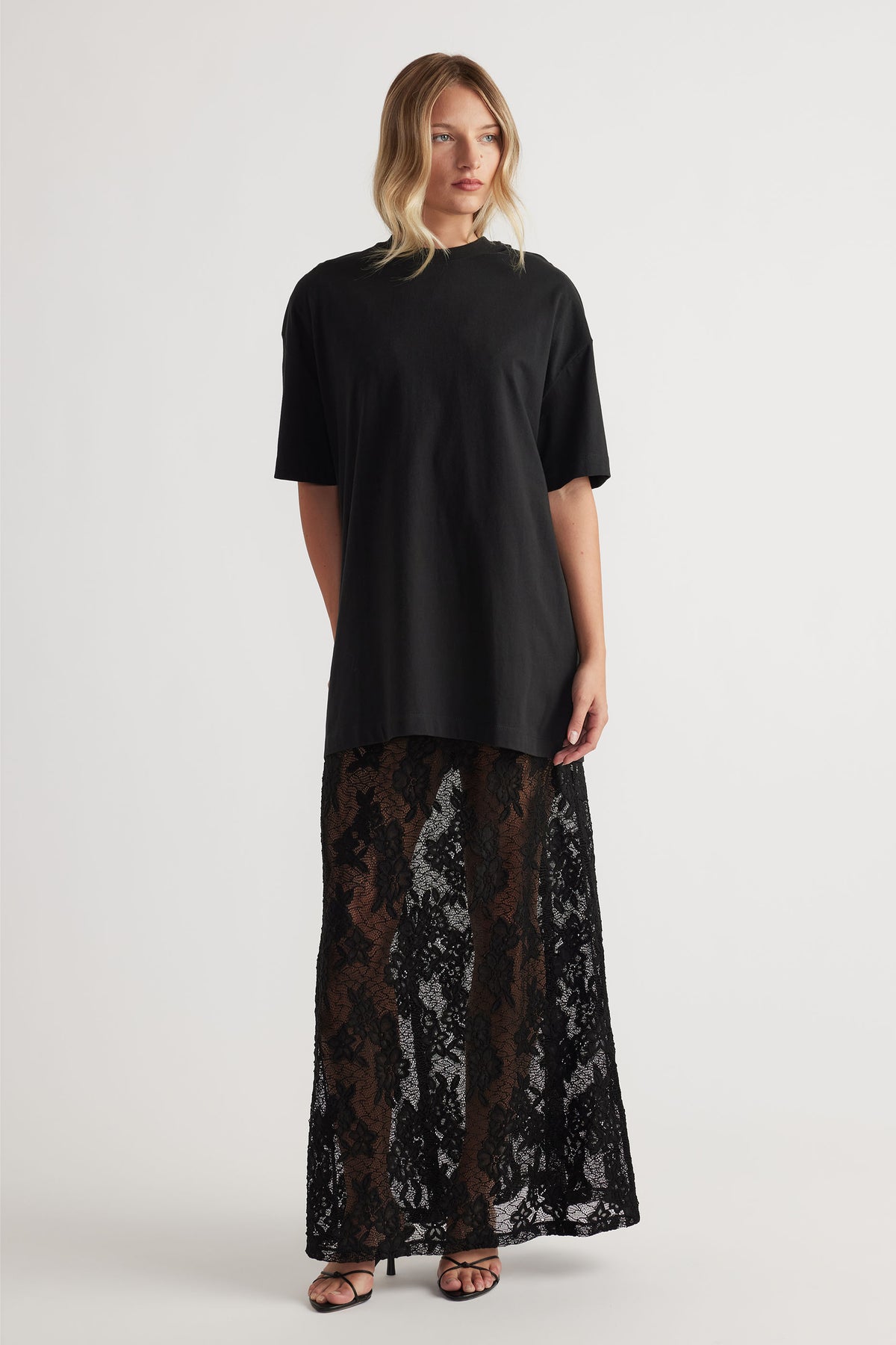Lace Maxi Skirt in black floral lace with sheer detail and long flowy fit, styled with relaxed black top by DECJUBA Australian brand