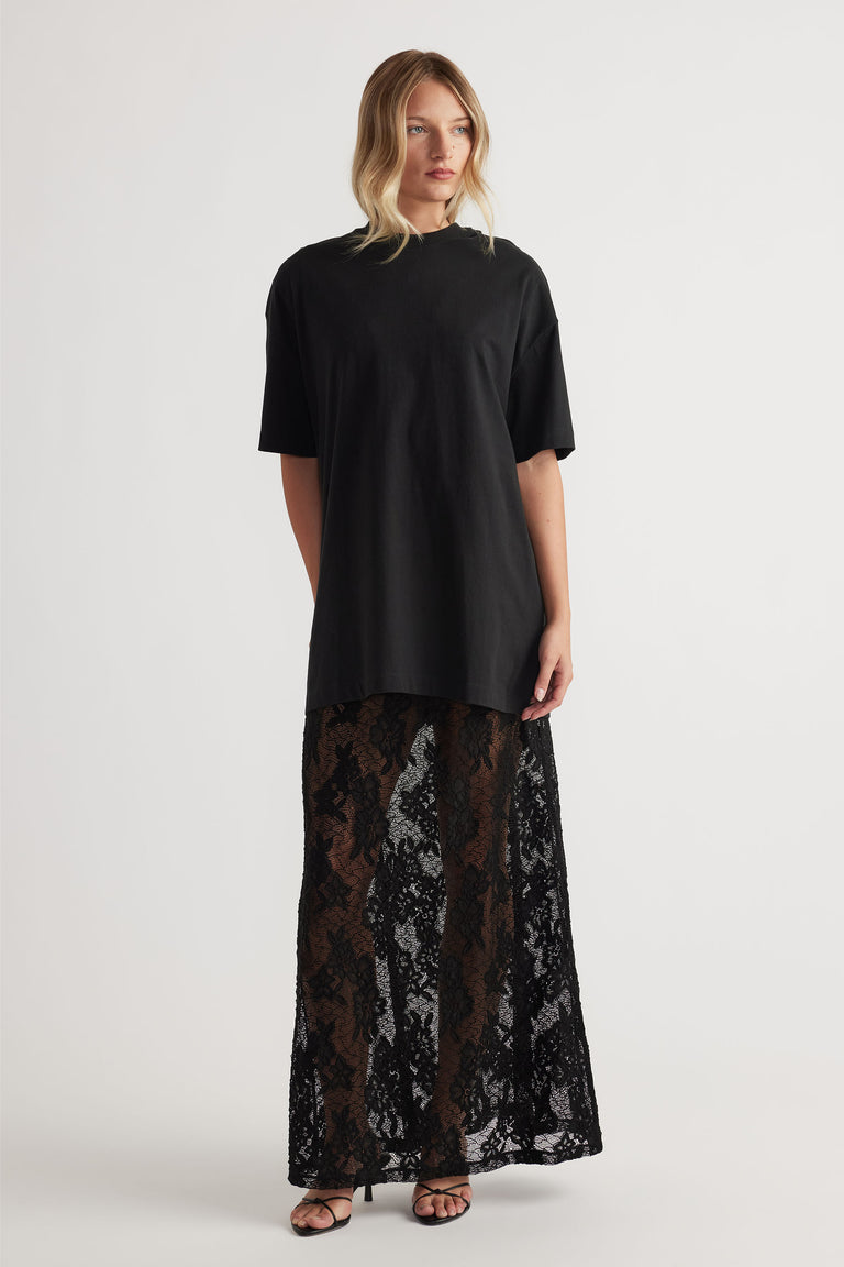 Lace Maxi Skirt in black floral lace with sheer detail and long flowy fit, styled with relaxed black top by DECJUBA Australian brand