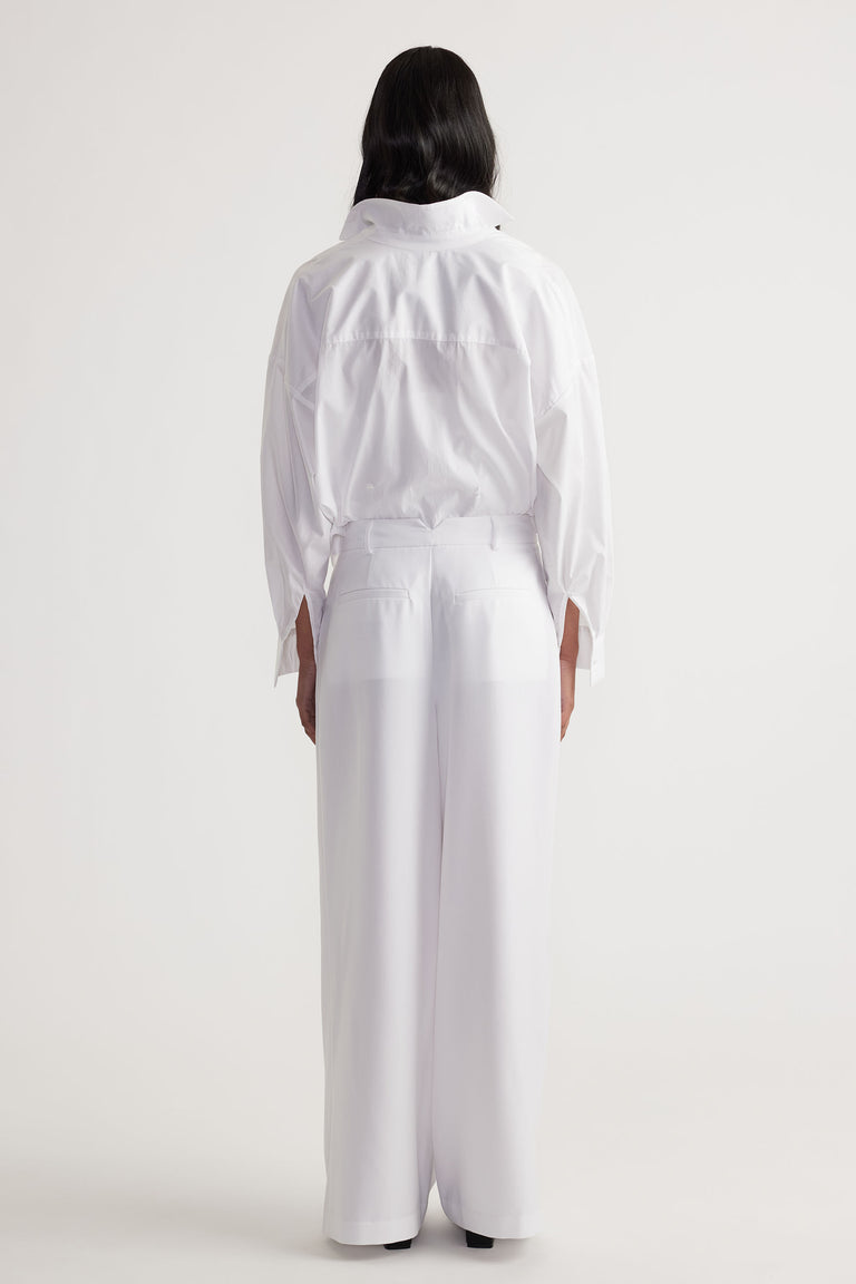 Clara Pleated Pant in white with wide-leg fit and high waist, styled from behind by DECJUBA Australian fashion brand