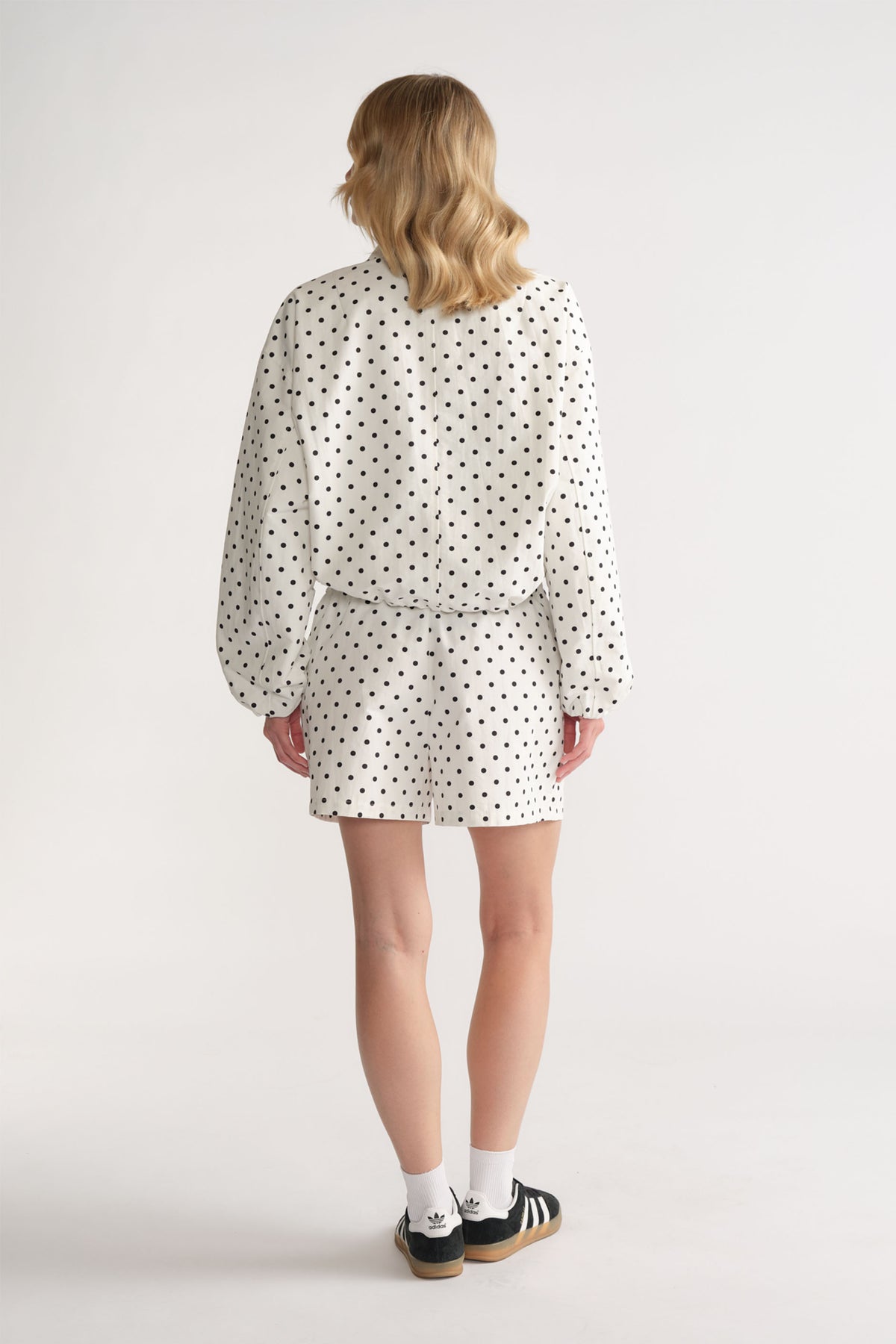 D-Luxe Polka Dot Short in white with black dots, relaxed fit styled from the back by DECJUBA Australian fashion brand