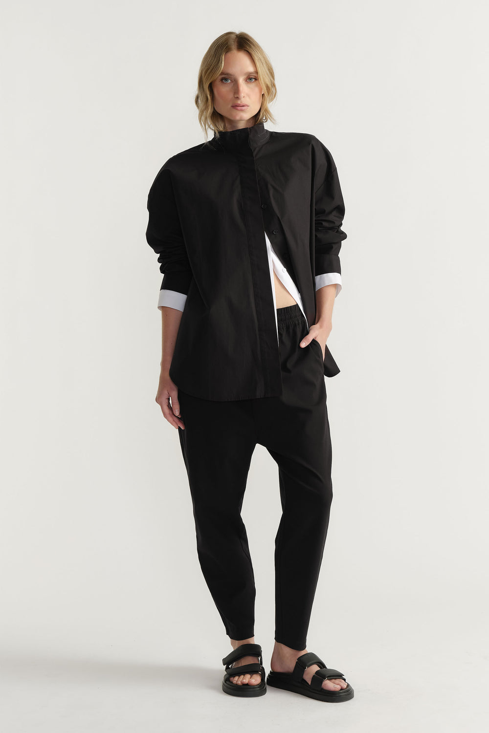 Woman wearing D-Luxe Button Up Shirt in 100% cotton with black fabric by DECJUBA Australian fashion brand