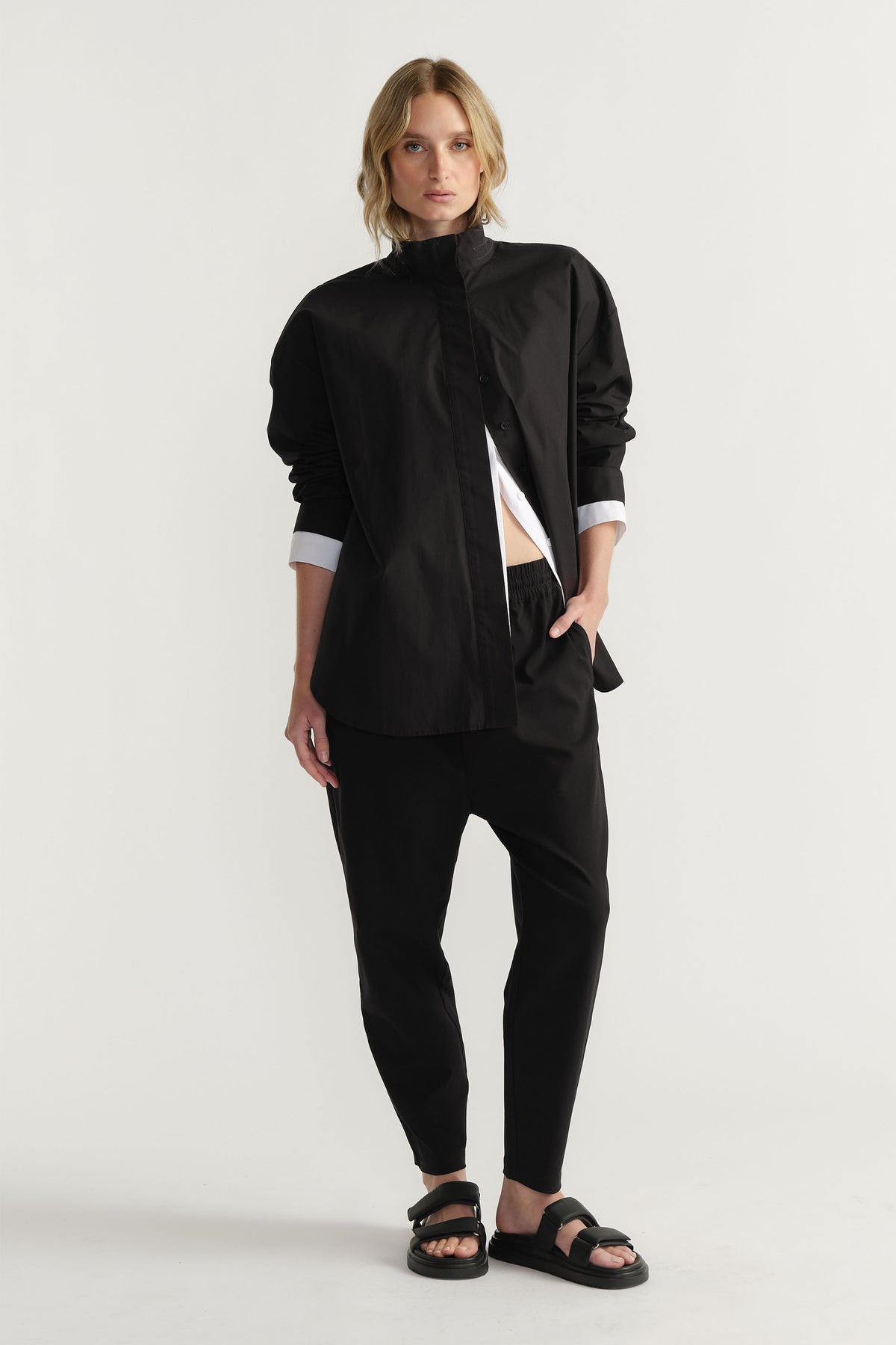 Woman wearing D-Luxe Button Up Shirt in 100% cotton with black fabric by DECJUBA Australian fashion brand