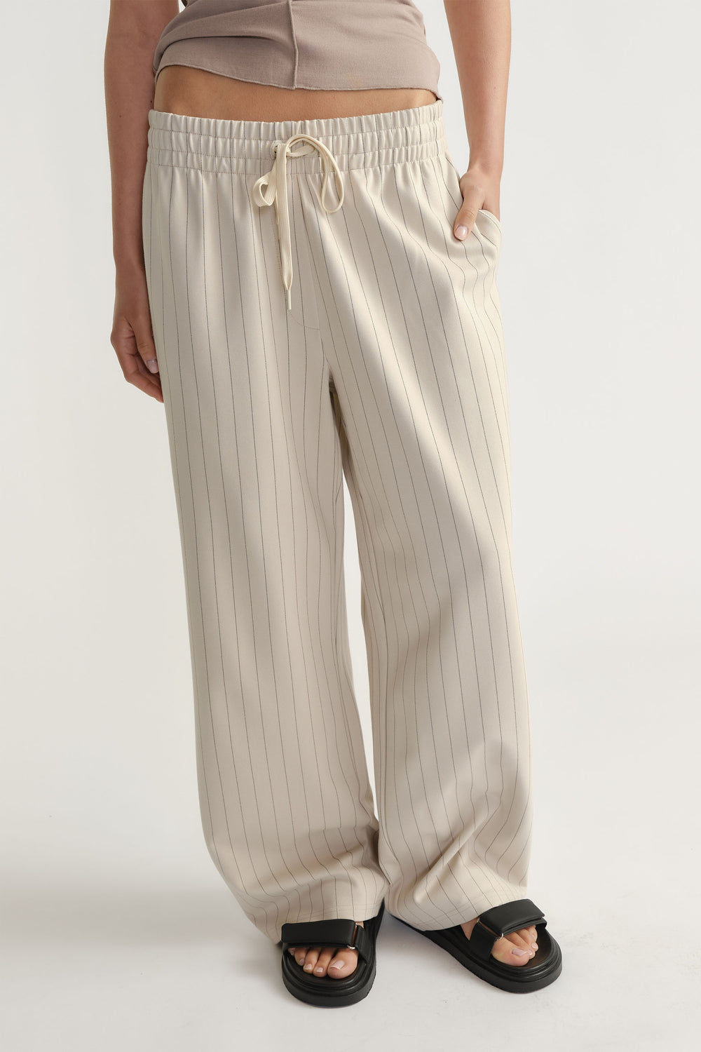 Front view of D-Luxe Pinstripe Pant in light beige with elastic waistband and relaxed wide-leg fit by Decjuba Australian brand