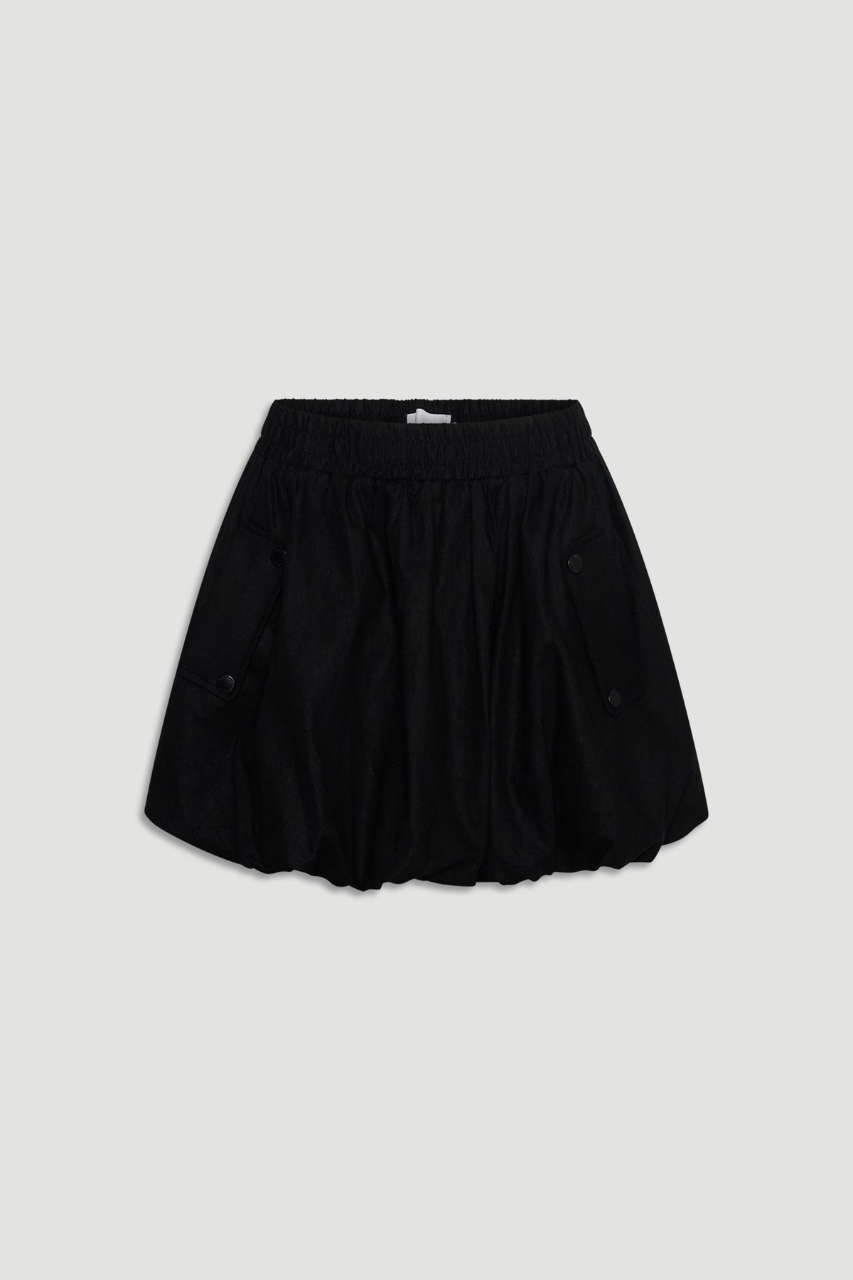 Black mini skirt with a bubble hem and elastic waistband, featuring buttoned side pockets for casual wear.