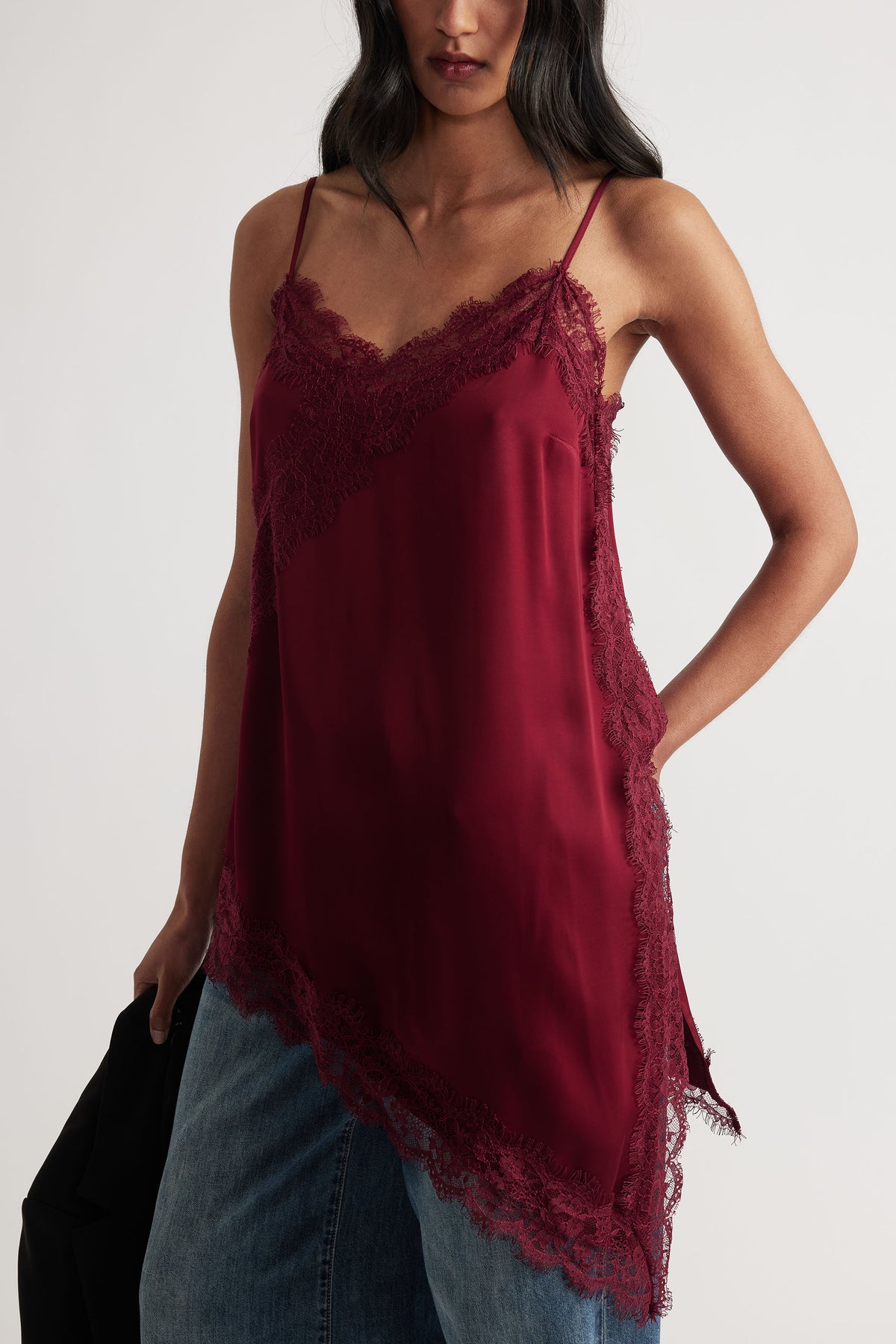 Woman wearing Karla Lace Tunic in deep red with delicate lace trim and spaghetti straps by Decjuba Australian fashion brand