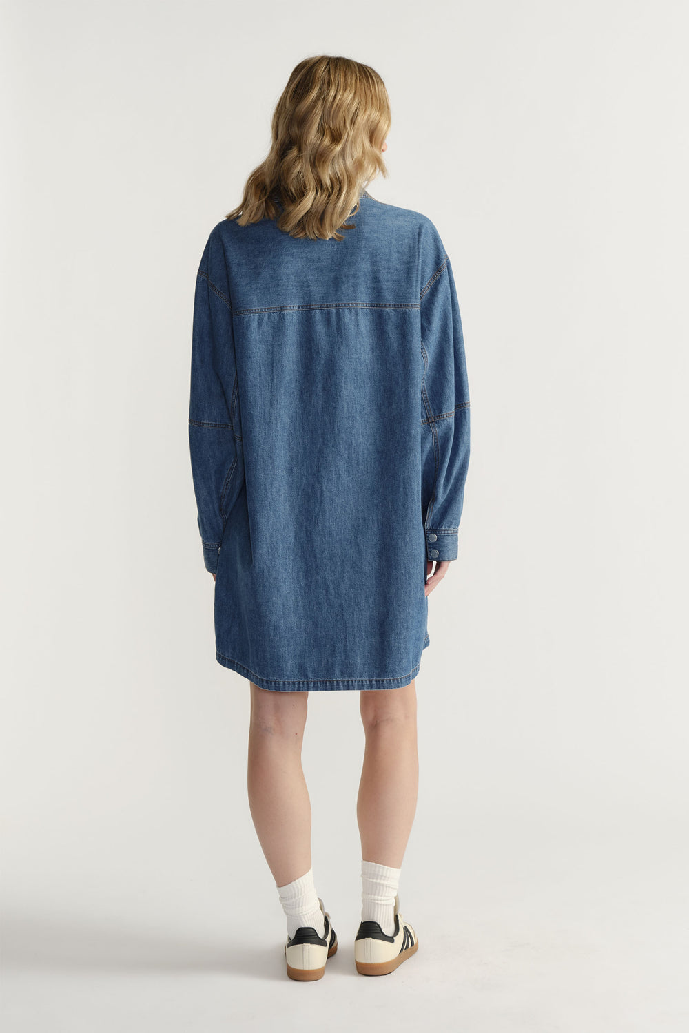 Back view of D-Luxe Chambray Stitch Dress in denim cotton with casual fit and detailed seam stitching by Decjuba