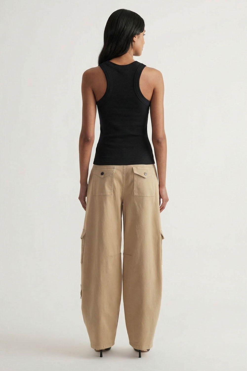 Charlotte Rib Tank in black ribbed knit paired with relaxed beige wide-leg pants, offering a chic casual look by DECJUBA Australian brand