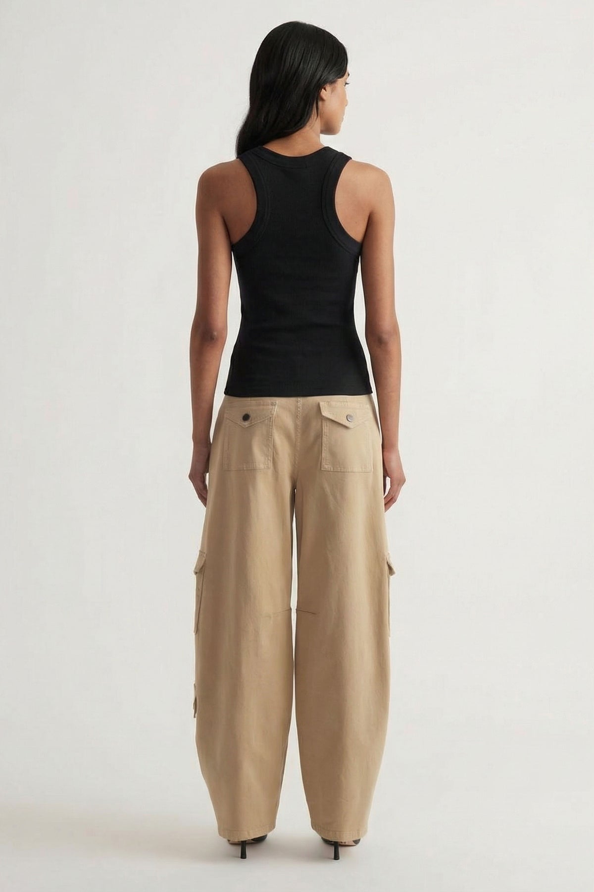 Charlotte Rib Tank in black ribbed knit paired with relaxed beige wide-leg pants, offering a chic casual look by DECJUBA Australian brand