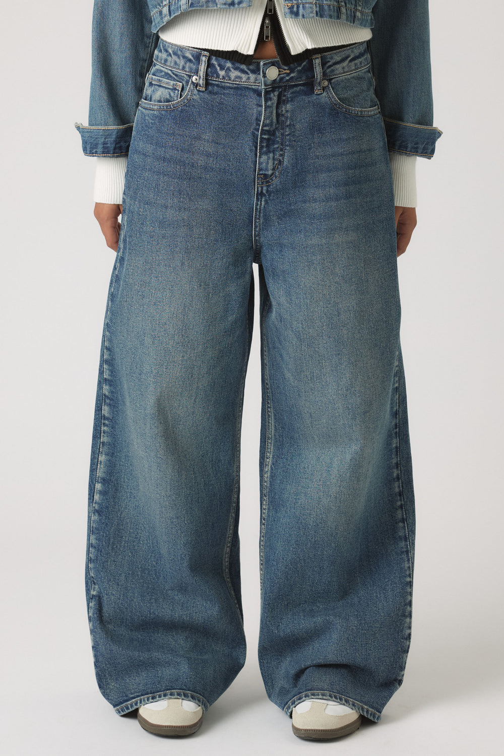 Girls Dad Baggy Jean in relaxed fit with mid-blue wash and high waist styled with cropped jacket by DECJUBA Australian fashion brand