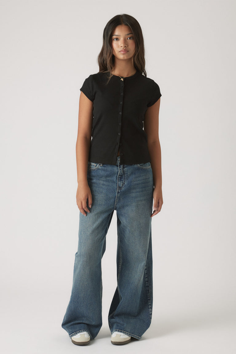Girls Riley Rib T-Shirt in black ribbed fabric styled with wide-leg blue denim jeans by DECJUBA Australian fashion brand