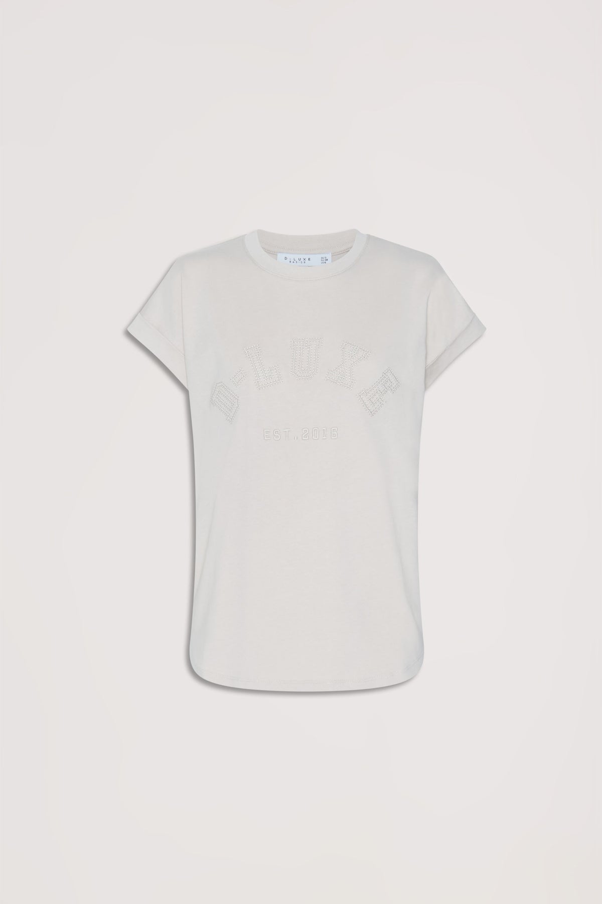 Soft shell-colored tee with subtle tonal collegiate lettering and relaxed short sleeves for casual everyday style.