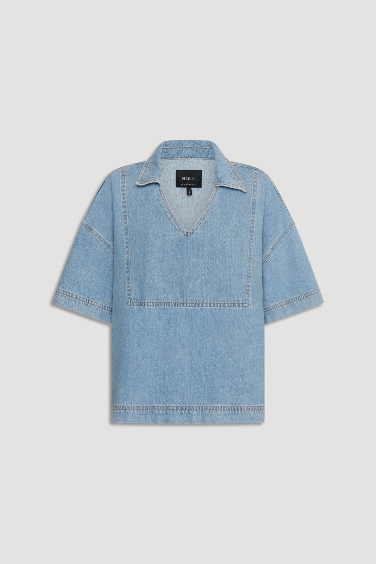 Light blue oversized denim shirt with short sleeves and a relaxed fit, featuring a deep V-neck and collar.