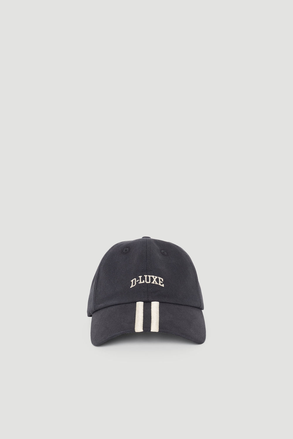 Navy cap with contrasting cream stripes and embroidered logo for a casual, stylish accessory.
