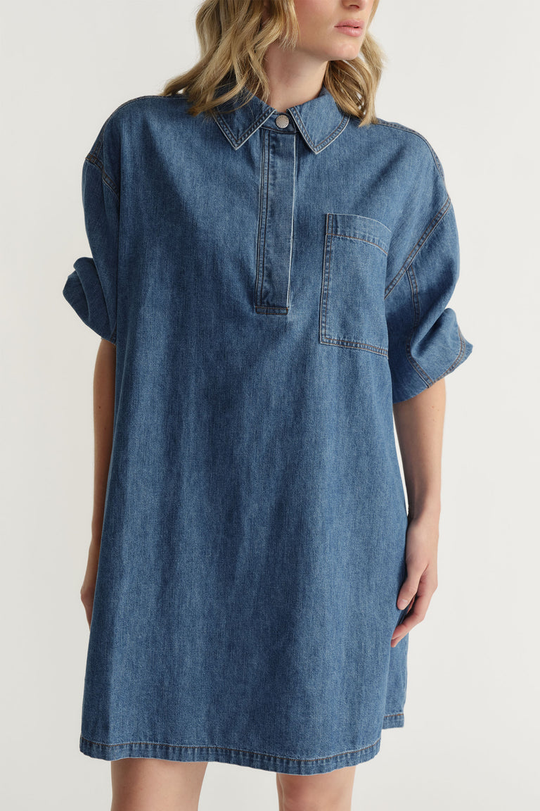 D-Luxe Chambray Stitch Dress in soft denim cotton with relaxed fit, collar, chest pocket, and rolled sleeves by Decjuba
