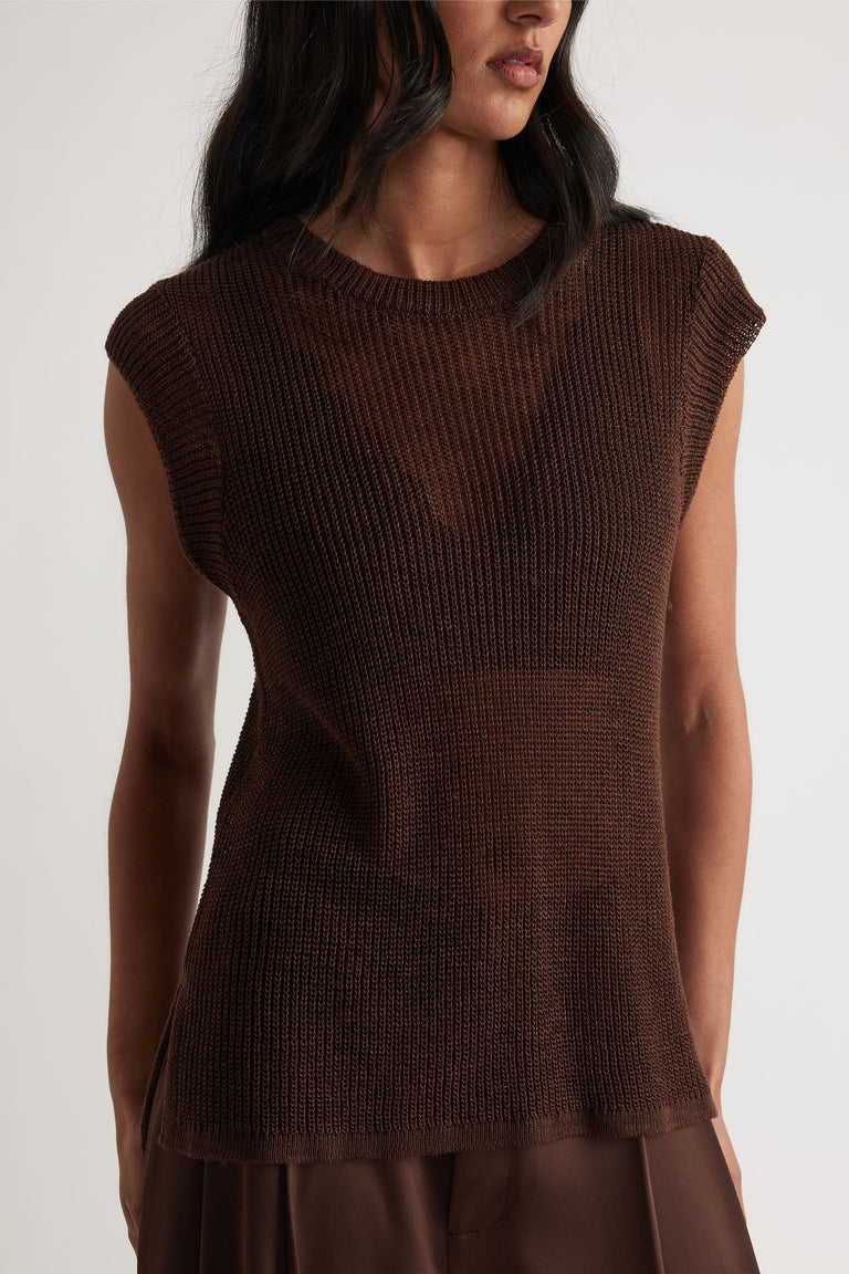 Sleeveless dark brown knit tank with relaxed fit and subtle ribbed texture for an easy, stylish layering piece