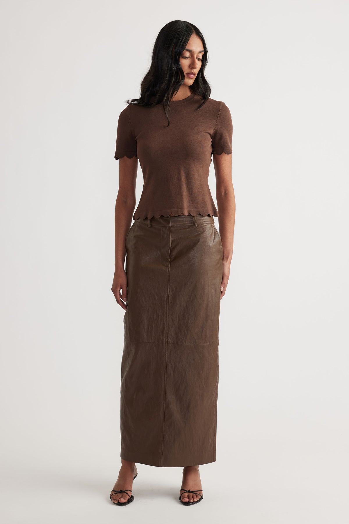 Faux Leather Maxi Skirt in deep brown with sleek silhouette, styled for a chic everyday look by DECJUBA Australian fashion brand