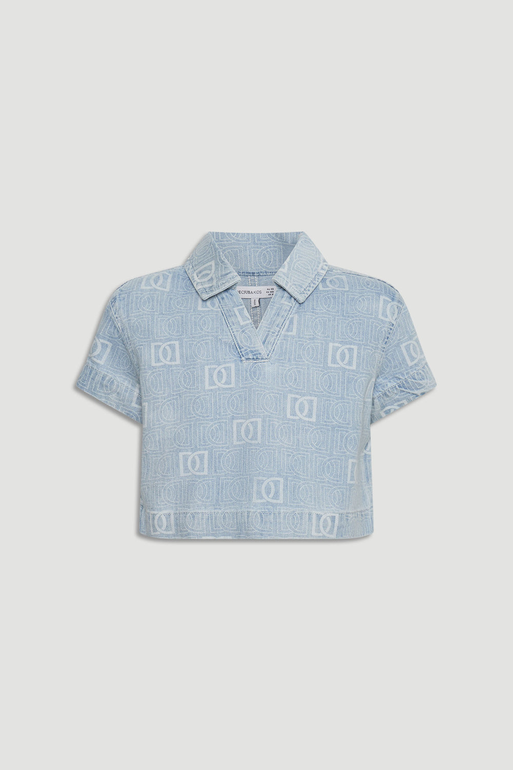 Light blue cropped denim shirt for girls featuring subtle all-over monogram pattern and short sleeves.