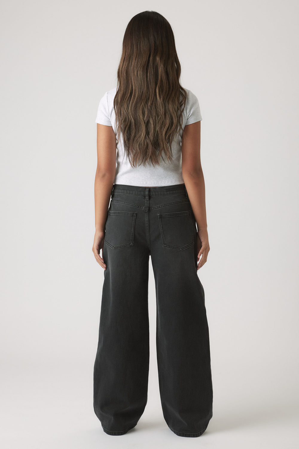 Back view of Girls Hailey Extra Long Jean in black denim with relaxed wide leg fit by Decjuba Australian fashion brand