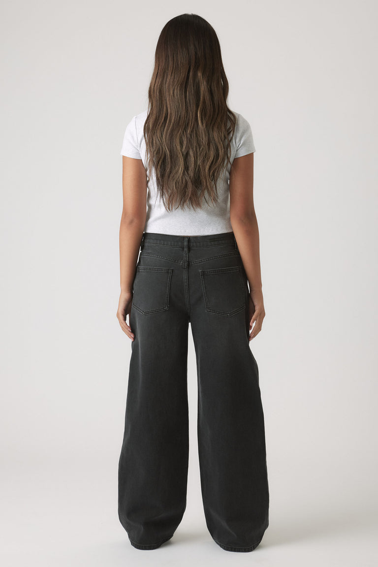 Back view of Girls Hailey Extra Long Jean in black denim with relaxed wide leg fit by Decjuba Australian fashion brand