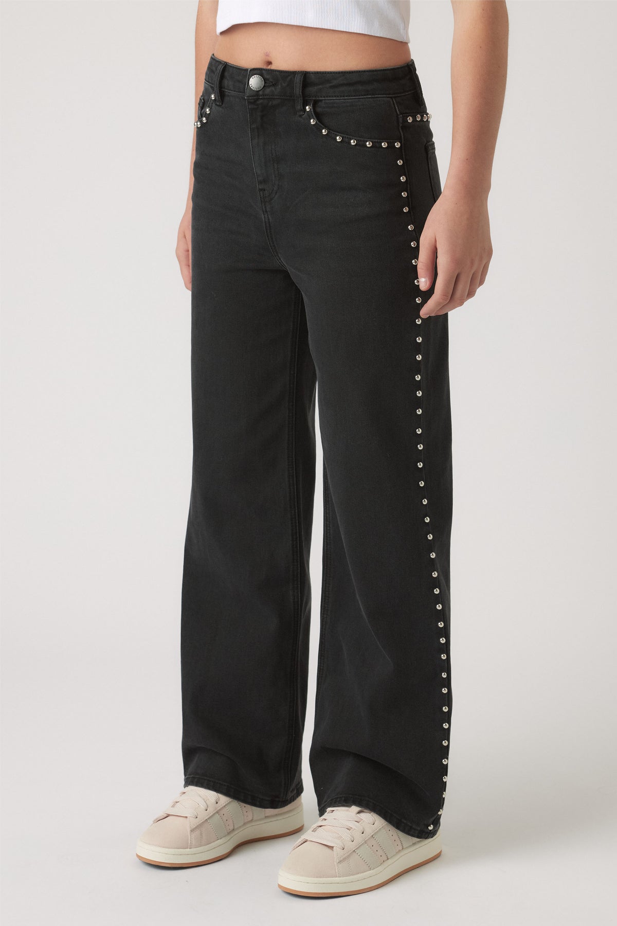 Girls Hailey Studded Jean in black denim with silver stud accents along pockets and leg seams by DECJUBA Australian fashion brand
